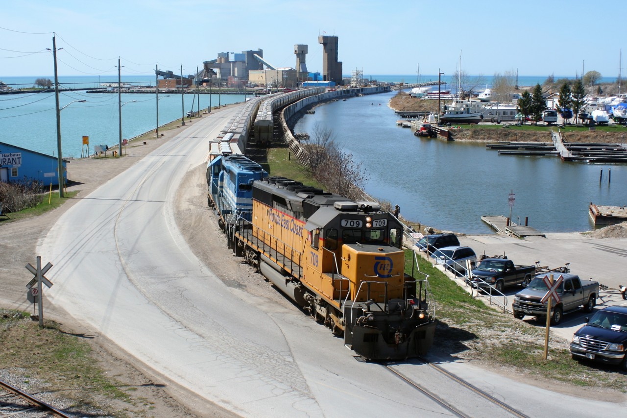 Goderich-Exeter Railway train 581 with borrowed Florida East Coast Railroad SD40-2 709 and GSCX SD40-2 7362 is seen lifting hoppers at the Goderich harbor on April 11, 2010.
