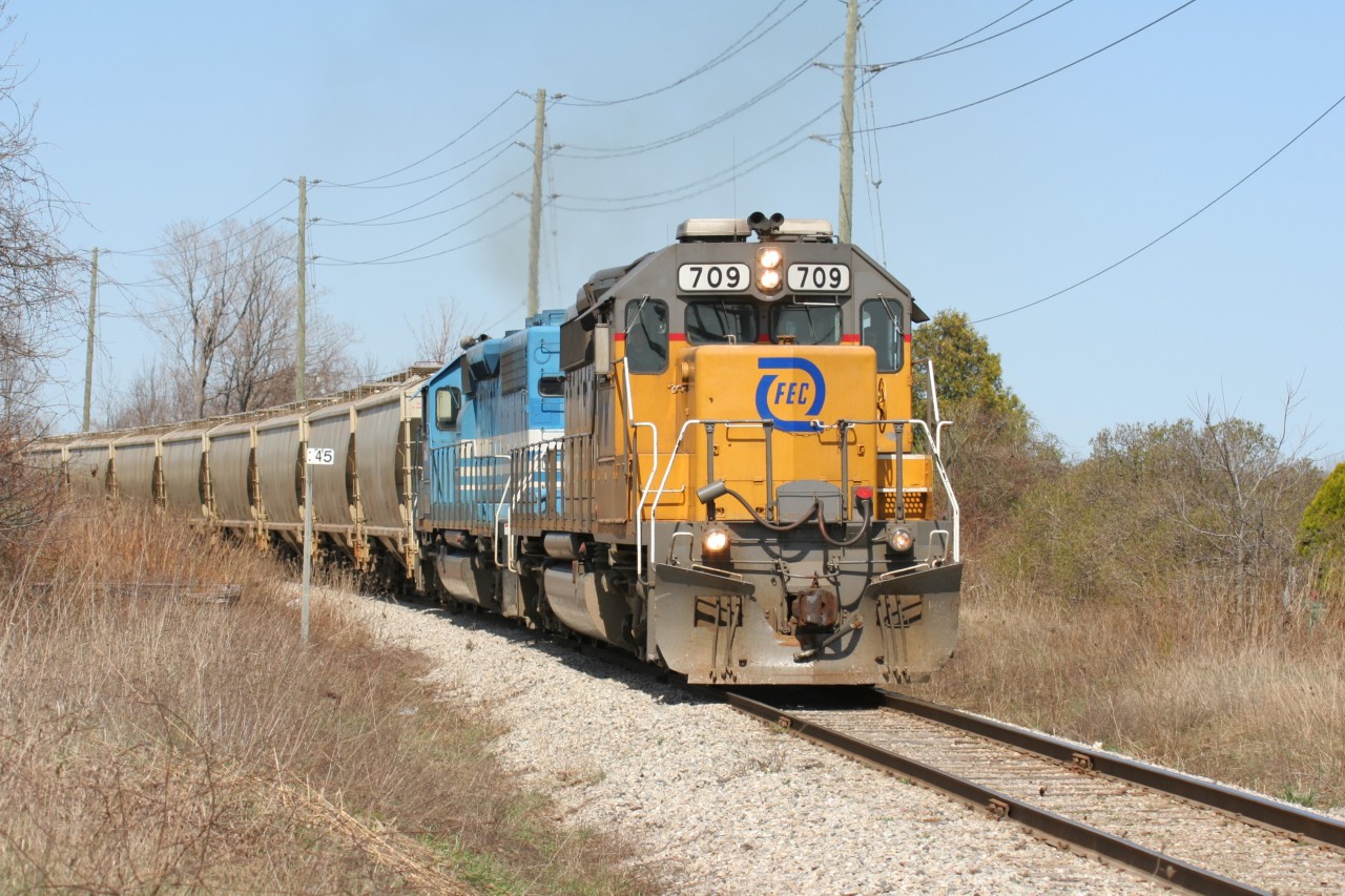 Goderich-Exeter Railway train 581 with borrowed Florida East Coast Railroad SD40-2 709 and GSCX SD40-2 7362 are viewed departing Goderich, Ontario with Stratford bound tonnage on April 11, 2010.