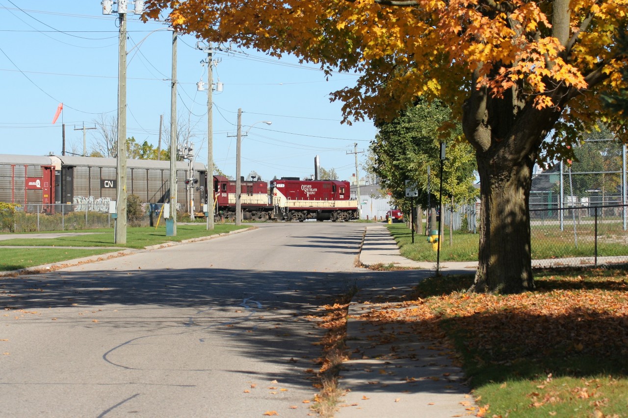 Ontario Southland Railway GP7 378 and RS23 503 are seen switching interchange traffic with Canadian Pacific at Woodstock on a pleasant fall morning.