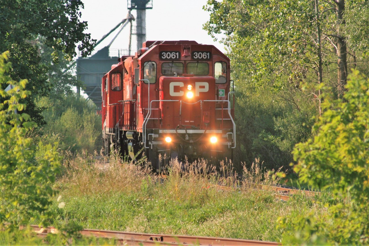 CP GP38-2 3061, GP9u 8248 and sister GP38-2 3062 are seen switching the seasonal traffic at the FS Partners facility on the Ayr Pit Spur in Ayr, Ontario.