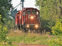 CP GP38-2 3061, GP9u 8248 and sister GP38-2 3062 are seen switching the seasonal traffic at the FS Partners facility on the Ayr Pit Spur in Ayr, Ontario. 