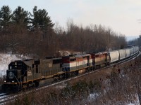 It's always nice catching an Illinois Central SD70 in the lead, especially considering how rarely they lead north of the border, and having a pair of BC Rail units trailing isn't bad either. Here we see train 396 hustling up grade at Scotch Block surrounded by fresh powder. 