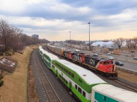 It's definitely not everyday you get to shoot a freight rolling through the heart of city on the Oakville sub. But today just happened to be on of those days, with a trio of GMD geeps and 88 racks on the drawbar.  CN 570 makes its way west along the Oakville Sub, as GO 918 rolls along heading east toward Union station, next stop exhibition station!