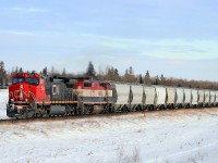 CN 2565 (Dash 9-44CW) and BCOL 4605 (Dash 8-40Cmu) head west past North Cooking Lake on a cold wintry afternoon.