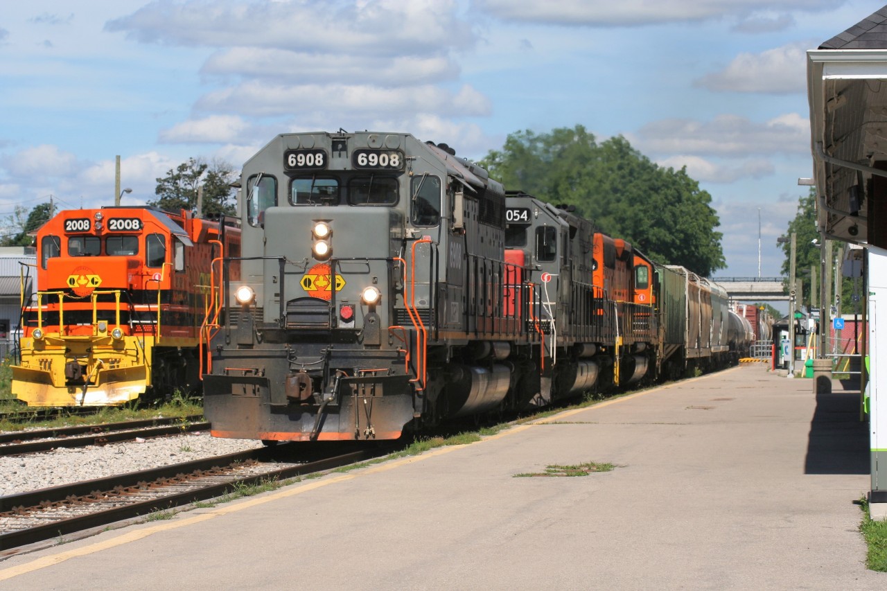 QGRY invasion....QGRY SD40-3 6908 leads Goderich-Exeter Railway train 431 by the power sitting at the historic station in Kitchener, Ontario on a beautiful July afternoon.