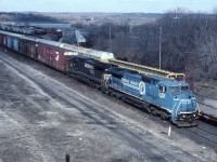 It's almost three years since the NS/CSX division of Conrail; however, quite a few units are still running around in the colours of the former owner. Today, train-watchers waiting for NS 328 are pleased to see that it has a "patched" former CR unit leading the daily St. Thomas-Buffalo train. NS started operating over the Talbot/Dundas/Grimsby/Stamford subs in July 1994 and gave up its trackage rights in December 2006.