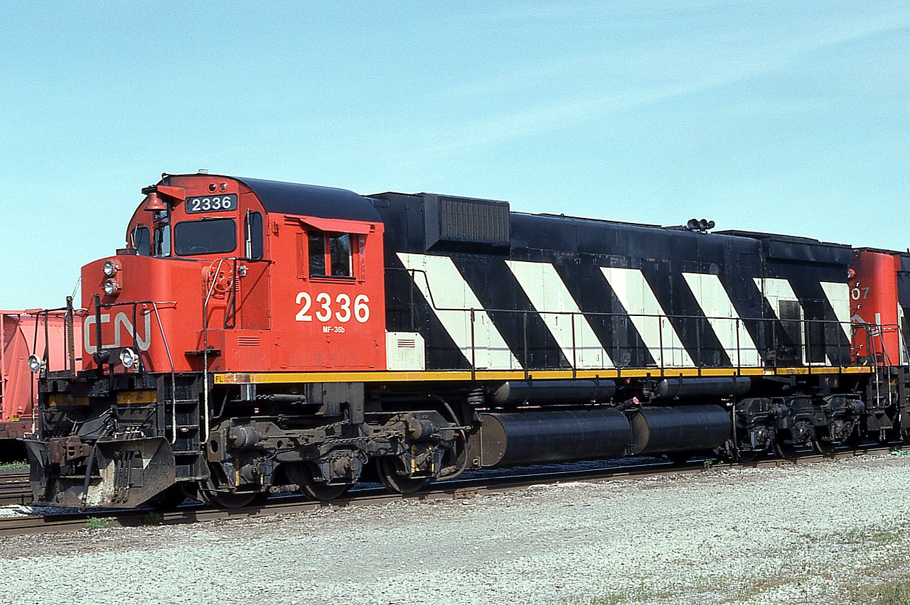 Every once in a while I come across a roster image I feel is worthy of submitting to Railpictures. This shot of CN 2336, MLW M-636, one of a series of these beasts built back in 1971, was a lucky catch positioned as well as could be within the confines of Niagara Falls CN yard. The series was retired between 1992-1998, and I think this one was one of the last to go.........