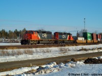 En-route with friends to meet up and party in the Sudbury area, I managed to get my crew to agree to stop for a train that somehow (Scanner?) I knew was coming. The trip was a beer drinking trip as usual, and I was the only one that liked trains, but a couple of us were into cameras so we did do the occasional train thing. Corrections always welcome, but this I believe is in Still River and would be a Northbound CN Freight on the CP Parry Sound sub, so I marked it as such after rekindling my memory. Love the motive power.. D70, 50mm f/1.8 fixed.