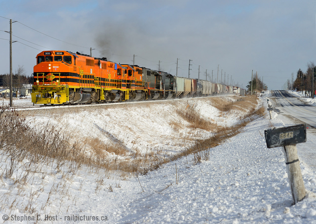 My favourite engine on GEXR in the lead in winter - doesn't it look sharp? Normally a pair of four axles in the lead westbound often indicates a rescue/helper set, but it's not. On the 23'rd GEXR 432 ran to Mac Yard but did not make it out on time, crew taxi'ed back to Stratford. On the 24th GEXR ran 2303/3030 with a train as 432, again, they died at Mac Yard and taxi'ed back to Stratford. What you see is the combination of both sets of motive power and as much tonnage as they could carry on the one-way GEXR 431 on Boxing Day, after the Christmas break. I didn't know what would be leading this day, and was pleasantly surprised.