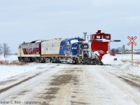 <a href=http://www.railpictures.ca/?attachment_id=31857 target=_blank>So earlier this morning I bet on two horses out of Stratford</a> and I was headed to Goderich following a GEXR plow extra</a> when I got word from a friend (With great thanks!) OSR was plowing. Three years to the day of something I never thought i'd be able to do again, so I had to find a way to do it. OSR started plowing the St. Thomas subdivision in the morning and the Port Burwell was next after a deadhead back, and I figured they'd take the Port Burwell around noon. Thing is, I only had a half day off and had to get back to work, so I cut off my GEXR chase near Clinton and went straight to Salford. I watched OSR plow the piss out of the Salford cut, then set up for shots at the De Bruyn farm where drifting was particularly heavy. After getting some good action shots there was a problem - a bolt snapped in the OSR's wing system and crew decided to reverse to the Salford shops to try to repair before proceeding to Tillsonburg. My chase was over and I decided to snap one last photo of the overall scene (above) - many of us have posted tonnes of photos of the business end of plows doing their thing, but sometimes it's nice to see the motive power instead<br><br>I had high hopes for some good action this winter and have been scoping things out already - I've made two trips to Stratford and three to Salford already, and came back empty handed more than once, but made up for it in spades on Tuesday. Thankfully, I bet on the right horses.