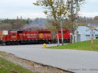And a shot that took years of planning and patience, having missed the ability to photograph any train near an old-school wooden Crossbuck in my youth (Most were replaced by the time I came of age) I was yearning for the opportunity to do so, and here it is.  Given the timing for this job in the day, I had to settle for an overcast day as it was usually a morning train which would have totally backlit this scene if sunny. Also of note, while taking this photo, the Manager of this (at the time) ADM facility was standing beside me because I wasn't apparently allowed to take photos OF their property (Not true, I can take photos of what I want, from public property, it's the law). I stood my ground and took my photos and did not tresspass. It was a very unpleasant experience but I got what I wanted. There was also a public trail but I didn't want to push it, this guy was a real asshole and would simply follow me on foot. Lucky for me, T15 had a rather interesting GP40 for a leader - is 4657 still with us? Needless to say I never tried again after this :)