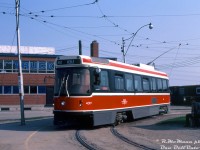 Toronto Transit Commission CLRV 4019, less than a year old and still looking factory fresh, pauses at the end of its westbound 512 St. Clair run at Keele Loop on the morning of May 4th 1980, ready to head back east. CN's West Toronto Yards can be seen off to the right, and the old car dealership behind was originally a CN Express and Telegram building (later becoming High Park Ford, then Church Motors Ford, and most recently Grenadier Ford).<br><br>Located just north of St. Clair Ave. W. on the east side of Weston Road, the new UTDC-built CLRV streetcars only served TTC's Keele Loop briefly. St. Clair streetcar service would be extended west to the newly constructed Maybank Loop (later renammed Gunn's Loop) to the west off St. Clair at Maybank Ave. at the end of July 1981, and Keele Loop would be closed. Presently a neighbourhood full of townhouses occupies this site.<br><br><i>Robert D. McMann photo, Daniel Dell'Unto collection.</i> 