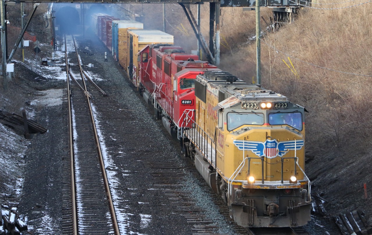 UP 4223 charge's out of the tunnel in Windsor, Ontario with CP T28.