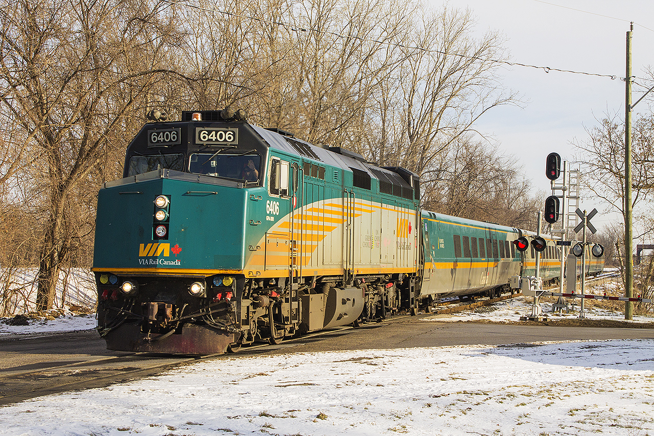 The weekend proved to be spectacular, having the sunshine again to photograph in after a very gloomy winter. However, all would not end up well for VIA Rail the next day as one of their own did not make it's scheduled stop in Chatham. But that didn't matter this day, as evidenced by the snowbank I was standing on to capture the friendly wave of the engineer as VIA 6406 cruises into Chatham with train 71 a little after 10am.