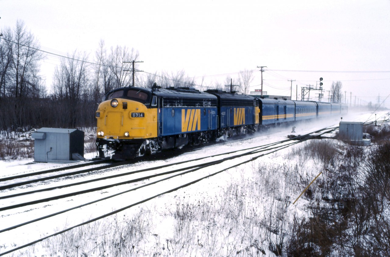 VIA FP9Au units 6314 and 6308 lead train 134 from Senneterre past Riviere des Prairies yard.