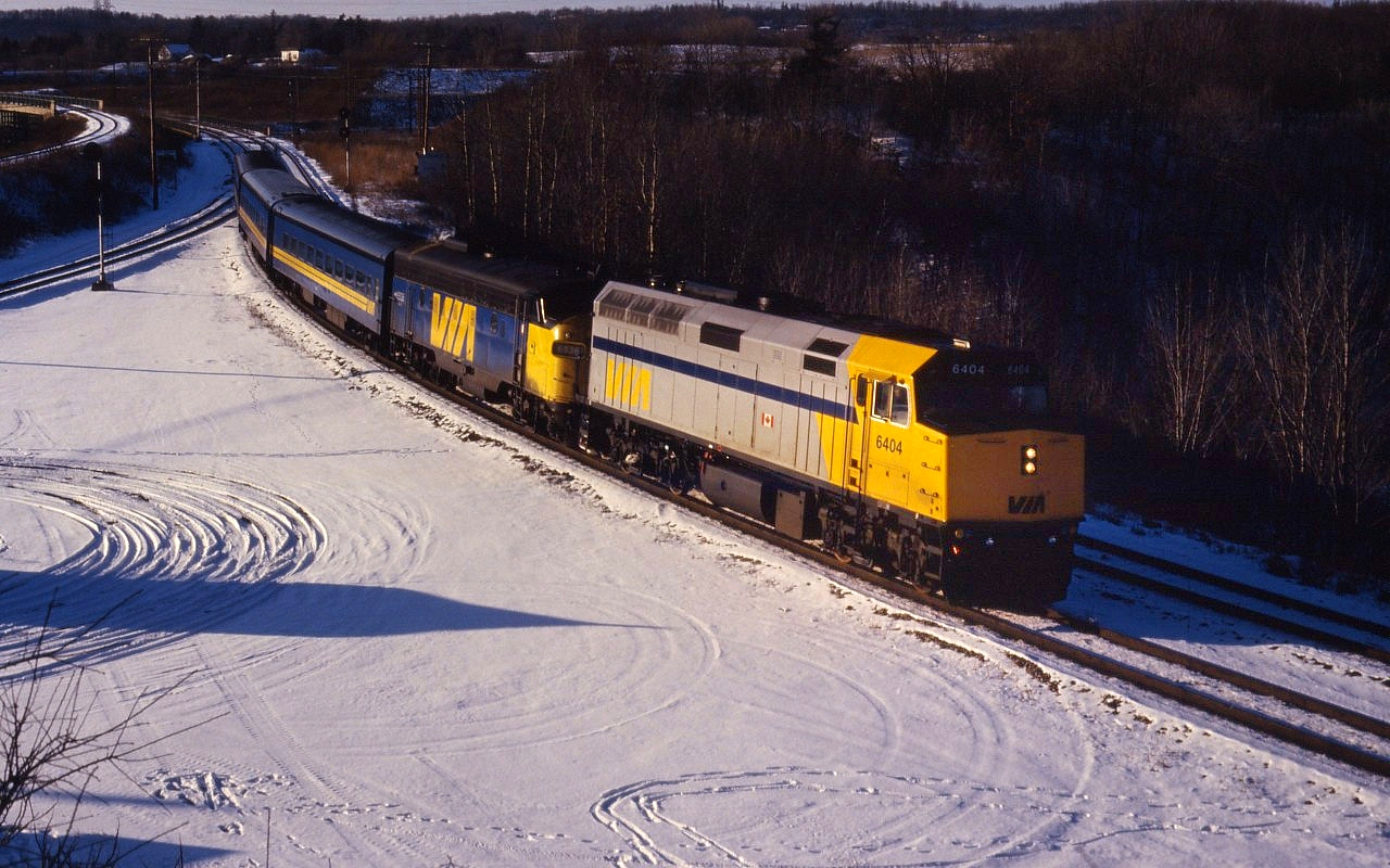 When VIA's F40PH-2s were new and on "shake-down" runs, it was common to see steam-generator equipped locomotives used for heating as well as "protection" power. Judging from the lighting, he train is likely Windsor-Toronto train number 74.