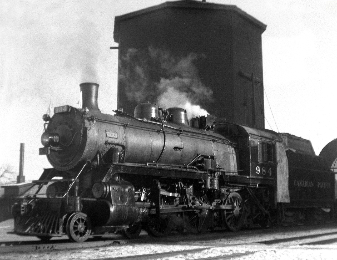 During visits to my grandmother on the CP main,as a 9 year old with a Kodak Brownie camera,I gravitated down to the station and photographed everything that would show up. In this shot an ubiquitous D-10 4-6-0 on a westbound Hi-Wide special pulls up to the water tank west of the station