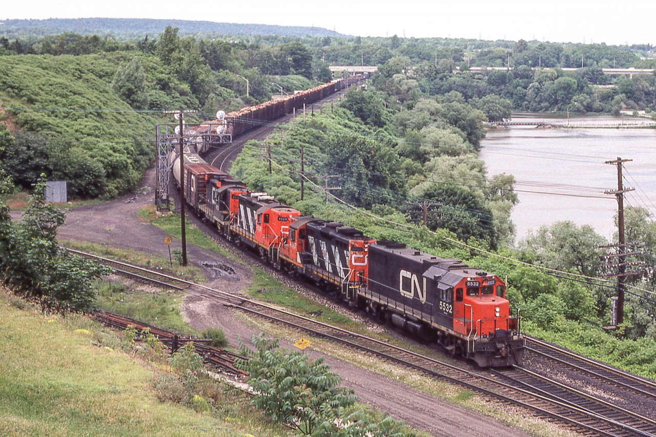 CN 5532 east is heading towards Hamilton, Ontario after passing through Bayview Junction on June 20, 1980.