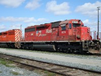 DME 6074 (ex CP SD40 5549) and CP 5946 an SD40-2 wait between assignments east of the fuel stand.