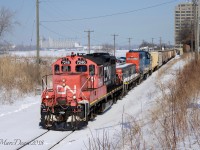 Having run down to the elevator light power and picking up one car, the IOX job will now return pushing 10 cars through down town Sarnia to Cargill.