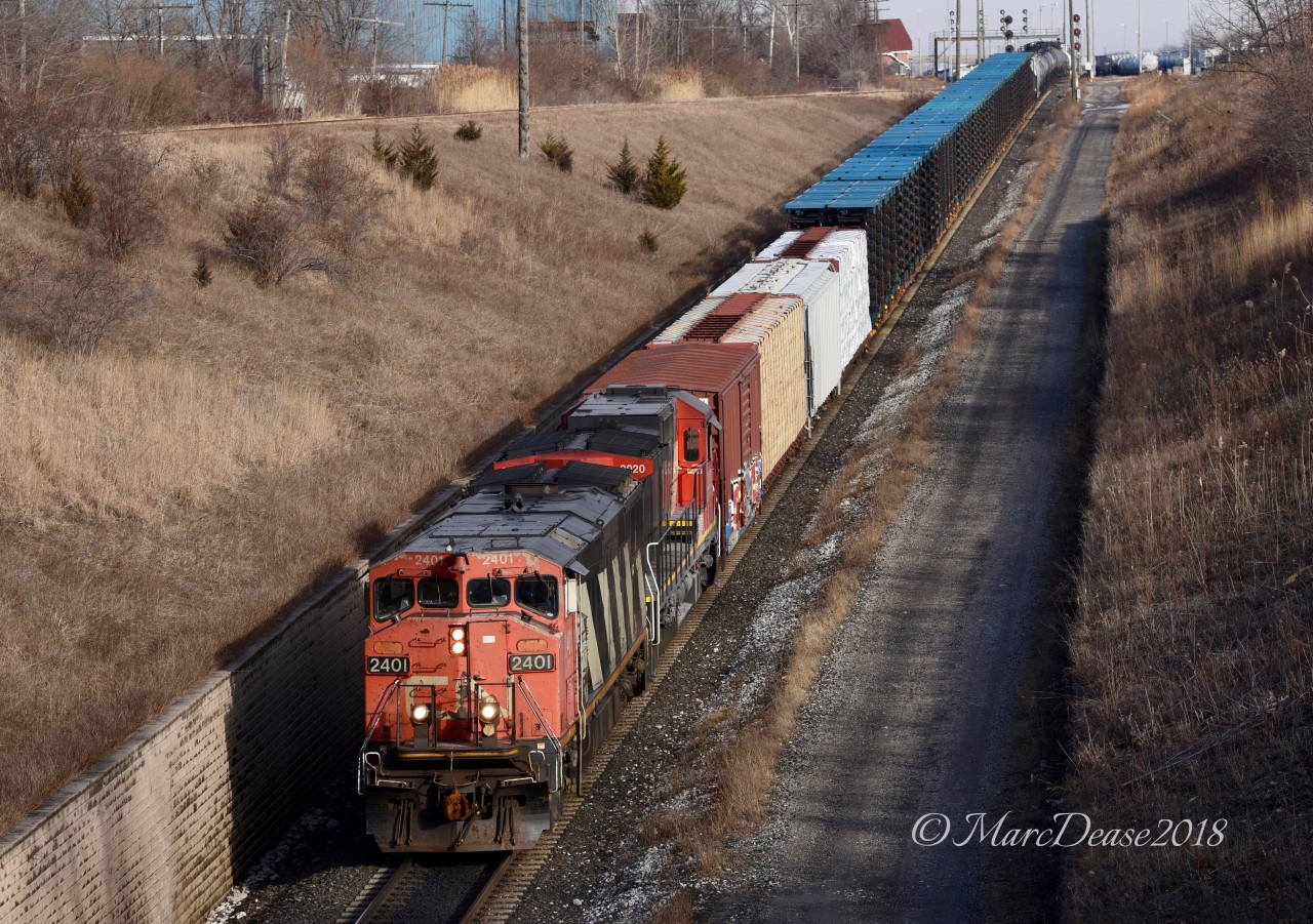 CN 2401 with CN 2020 lead train 501 out of Sarnia through the St. Clair River Tunnel to Port Huron, MI.