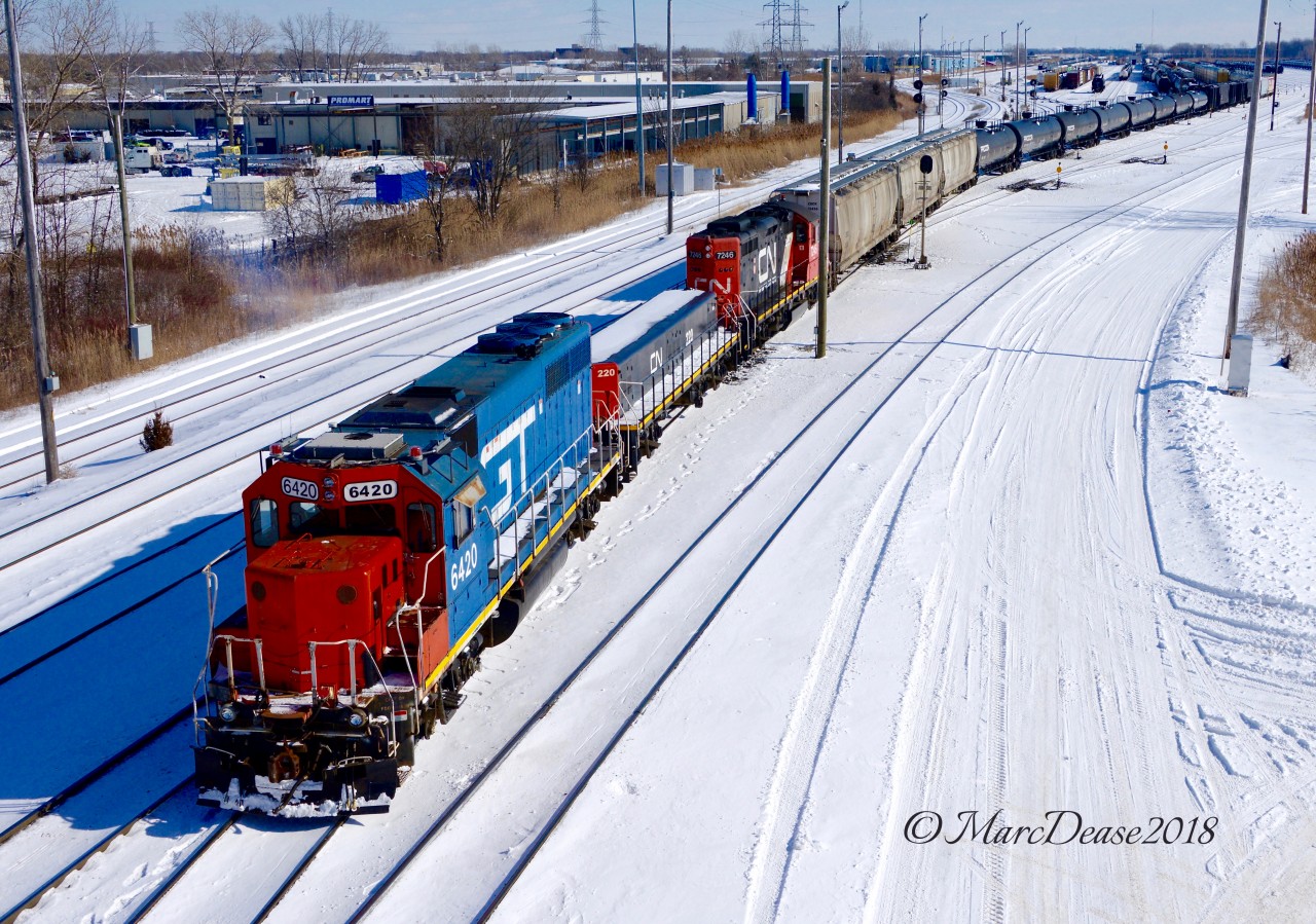 GT 6420 leads a large cut of cars from A yard to C yard in Sarnia.