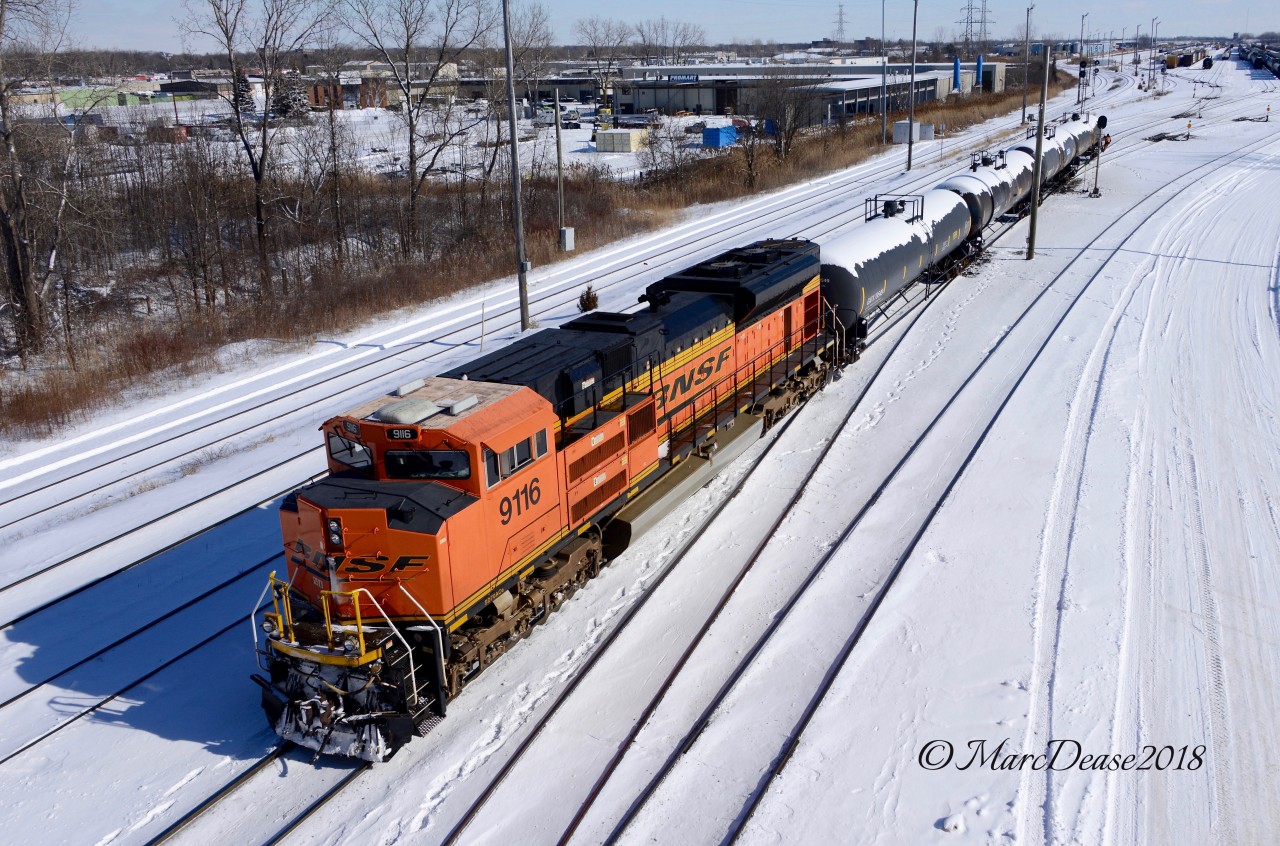 Having come across into Sarnia earlier leading train 504, BNSF 9116 pushes a small cut of cars into A yard in Sarnia.