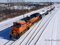 Having come across into Sarnia earlier leading train 504, BNSF 9116 pushes a small cut of cars into A yard in Sarnia.