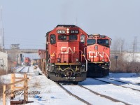 Train 148 eases by Train X312 on its way out of Sarnia, ON. Train X312 would be delayed about 6 hours due to air issues on its train.