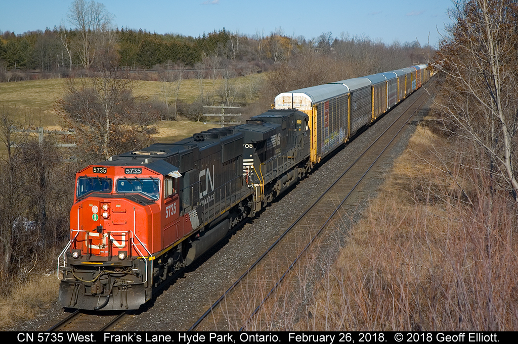 A quick stop by Frank's Lane on the way home from a meeting in London snags CN 5735 West with an NS "Catfish" and a HUGE mixed train trailing.