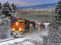 After the first big snowfall of the season, westbound train 406 heads through the nice snowy scene at Passekeag, New Brunswick. 