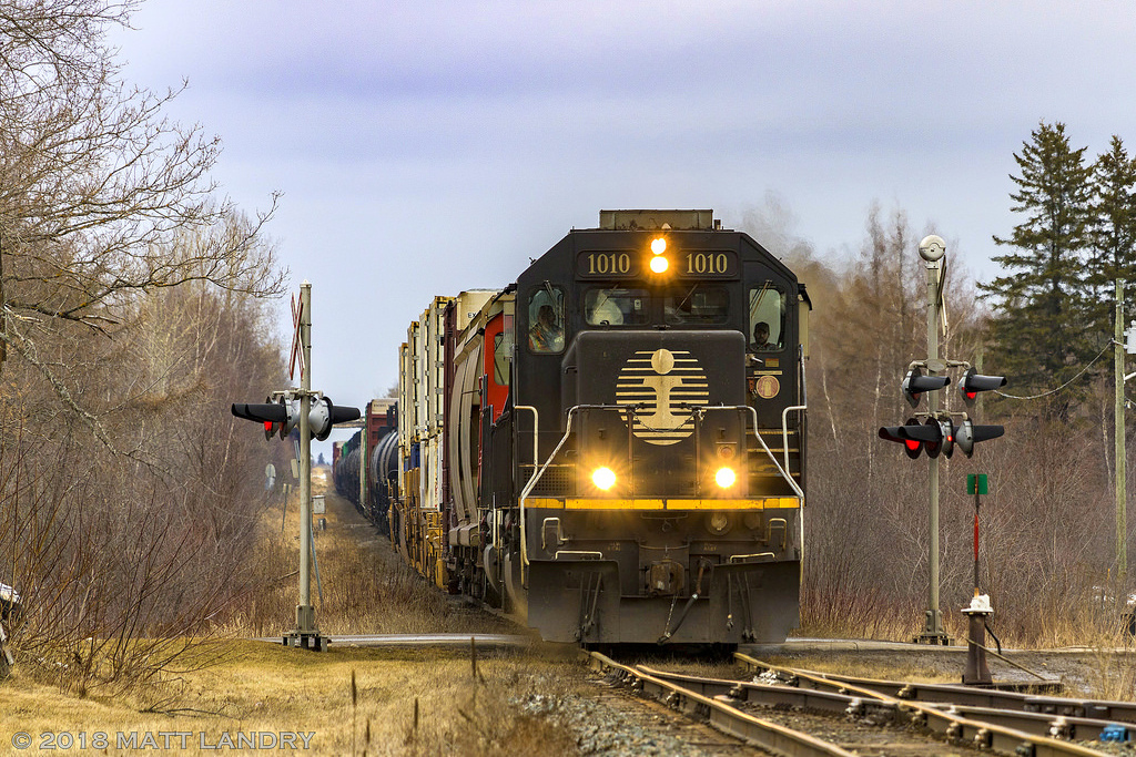 Death Star, IC 1010 leads train A406, as they rumble through the town of Petitcodiac, New Brunswick. An SD60, CN 5480, trails in this killer consist.