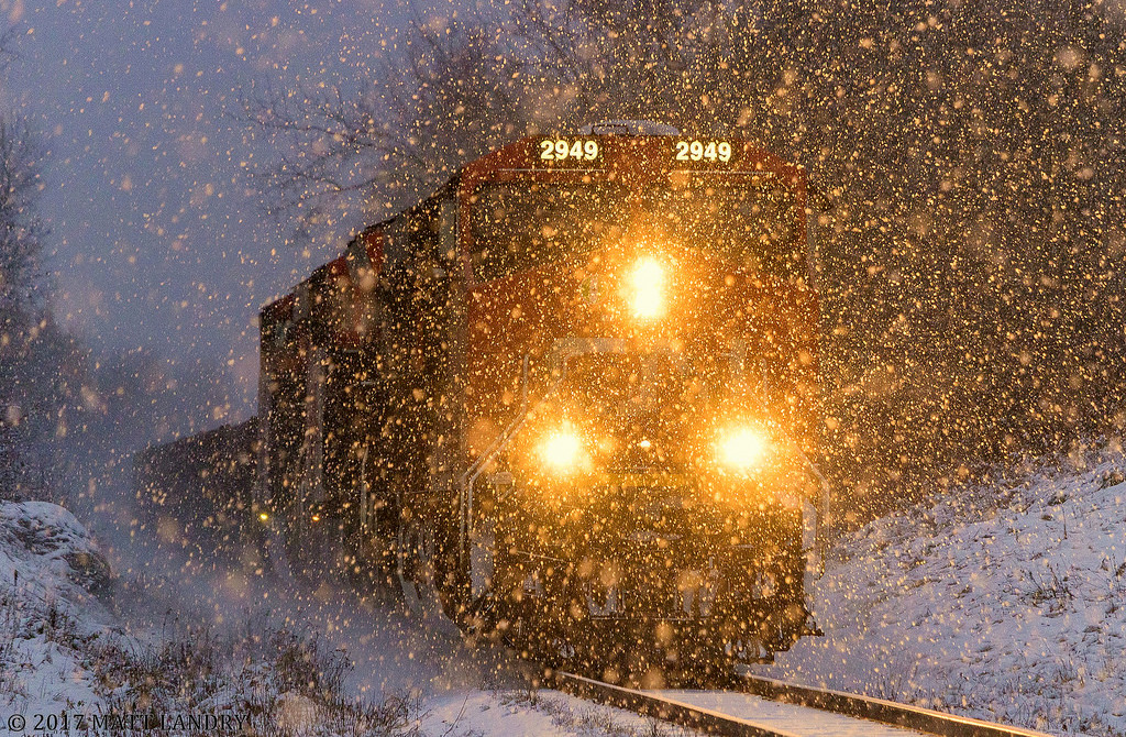 With another day almost done, and the snow starting to fall, westbound 406 approaches Hampton, New Brunswick.