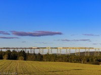 In some late Fall evening light, eastbound train M306 crosses the massive Salmon River Trestle, at New Denmark, New Brunswick. The bridge stands at 3,920 feet in length, and as far as I know, is the second longest in Canada.