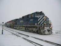 another snowy dull day at Exeter yard as train 470 paused I took this grab shot. 470 was on it's way to Lillooet BC. quite often this daily train would have work at Exeter yard, setting out supplies for the local mills and picking up loads destined for North Vancouver and points beyond.