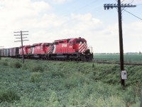  CP 5535 with 5794 & 5526 elephant style heading east near Chatham. Sorry I do not have the exact location, train number etc. I'm sure the fellow that was standing there with me might be able to recall from his well kept notes the date, train number, number of cars as well as the caboose number.