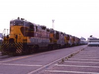 The Agawa Canyon tour train at the ACR's Sault Ste. Marie station in the summer of 1979 with a 5 unit GP7/GP7 rebuild lash-up (153, 154, 104, 102 and 103).