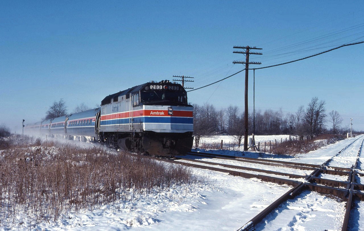 This must be one of the last Amtrak Niagara Rainbow trains--although newly equipped with F40PH locomotives and Amfleet cars, the train only operated until January 31, 1979 when the service was truncated at Niagara Falls, NY. Here we have Amtrak No. 64 passing through Canfield on its journey over the Conrail Canada Division between Detroit and Niagara Falls.