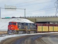 A pair of DASH 9-44CW's, CN 2204 and BCOL 4654 head west on the passing siding at Clover Bar.