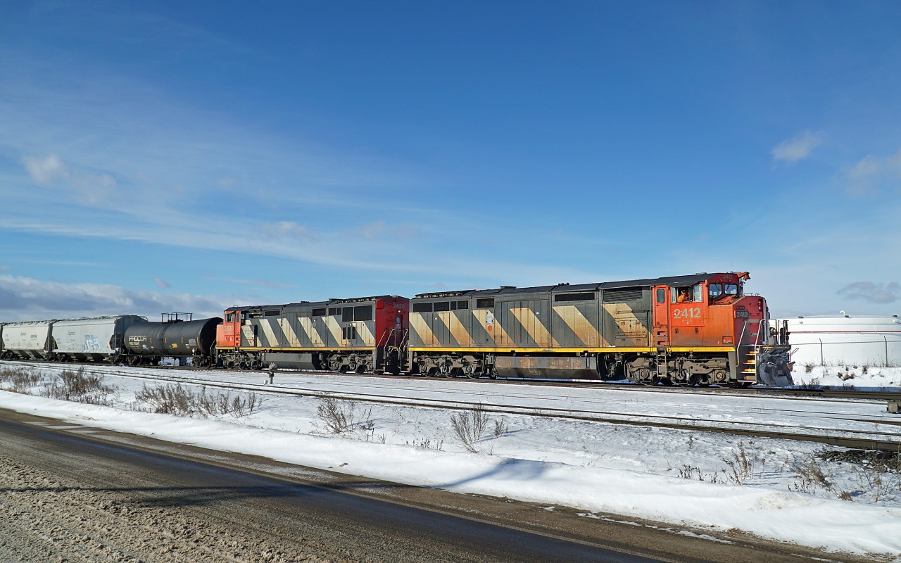 A pair of "Draper Taper" Dash 8's, CN 2412 and 2420 head east through Clover Bar.