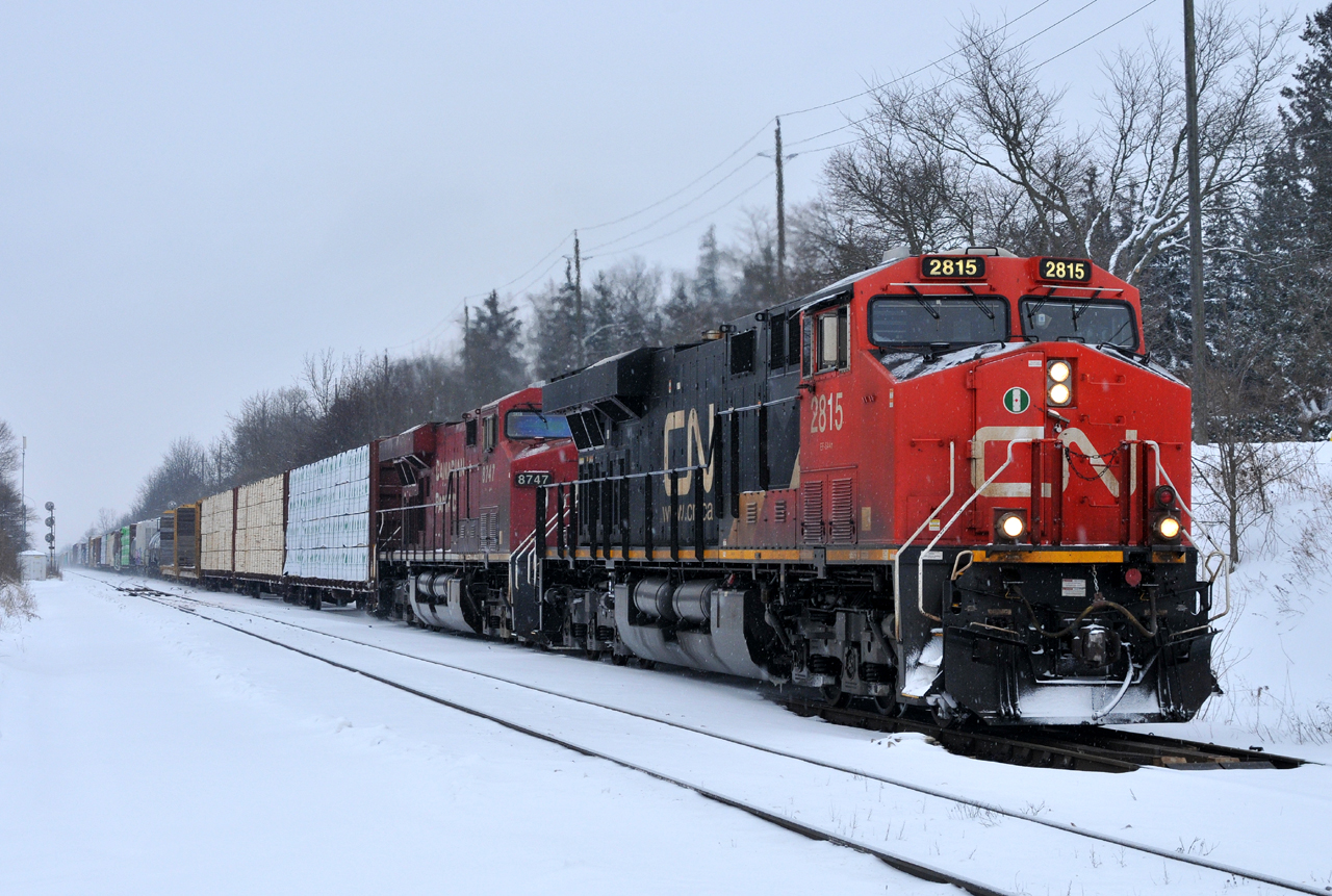 CN 2815, and CP 8747 lead M38531 10 through Hardy with 165 cars