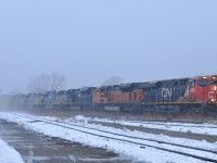 CN M39491 14 emerging from the fog with CN 2885, BNSF 9167, PRLX 4847, PRLX 4846, PRLX 4844, PRLX 4840, and 175 cars.

The four ex-CSXT SD70ACe's are destined for Pointe-Noire, PQ
