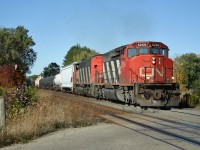 Toronto to Sarnia drag 411 crosses 15th Side Road in Stewarttown with CN 5259 and CN 5404 doing the honours.