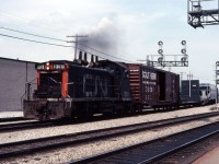 SW1200RS 1319 leads the way freight through Burlington after switching industries on the Halton sub. Over the years, at times this train originated in Burlington (with power and van deadheading to Hamilton for servicing) and, at other times, it originated at Stuart Street Yard and ran to Burlington.