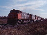 In what looks like a late fall shot (processed in January 1985), we see a Canadian National eastbound moving through the rural part of Burlington. 2530 was the first unit in CN's second order for M420Ws back in 1974. It is trailed by 1981-built HR412 2581, F7Bu 9195, and GP40-2LW 9434.