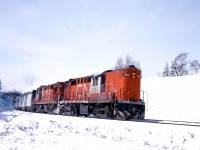 On a bitterly cold day, CN RS18 3153 leads sister 3152 through Bayview with the first train of the day from Windsor, "Tempo" 140.
