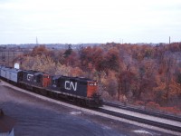 In the early 1970s, CN regularly assigned GP9s to passenger service in southwestern Ontario. Today, we have a bonus--leased GTW passenger GP9 4921 accompanying CN GP9 4104 on an eastbound passenger headed for Toronto. Note the generator equipped baggage car which provided HEP (head end power) to the Tempo coaches.