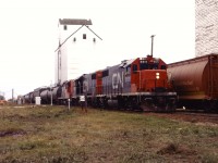 Recently transferred from eastern Canada, CN GP38-2 5511 leads another '38 and a GP9 back towards Winnipeg after exchanging traffic with the BN and Soo Line in Noyes.