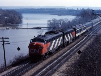 VIA took over passenger service from CN on April 1, 1978 and from CP on September 29, 1978. As you can see from this photo, while some cars were in "VIA CN" blue, many other cars and locomotives still had CN paint and markings after "Day 1". In this photo we see an eastbound train with FP9 6531 and FPA4 6772 accelerating away from Bayview (looking at the lighting, it is likely No. 76 from Windsor).
