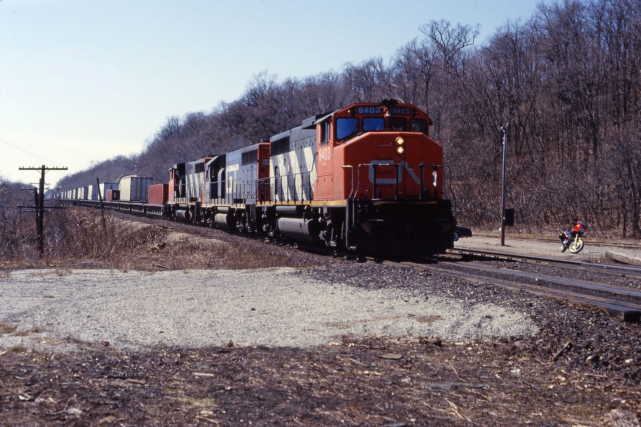 CN started its "Laser" intermodal service to and from Chicago in the mid-1980s. In early days, it often ran with a trio of Grand Trunk Western GP40s/GP40-2s but later operated with CN comfort cabs leading "pooled" GTW locomotives. Over thirty years later, the service continues to run as 148.
